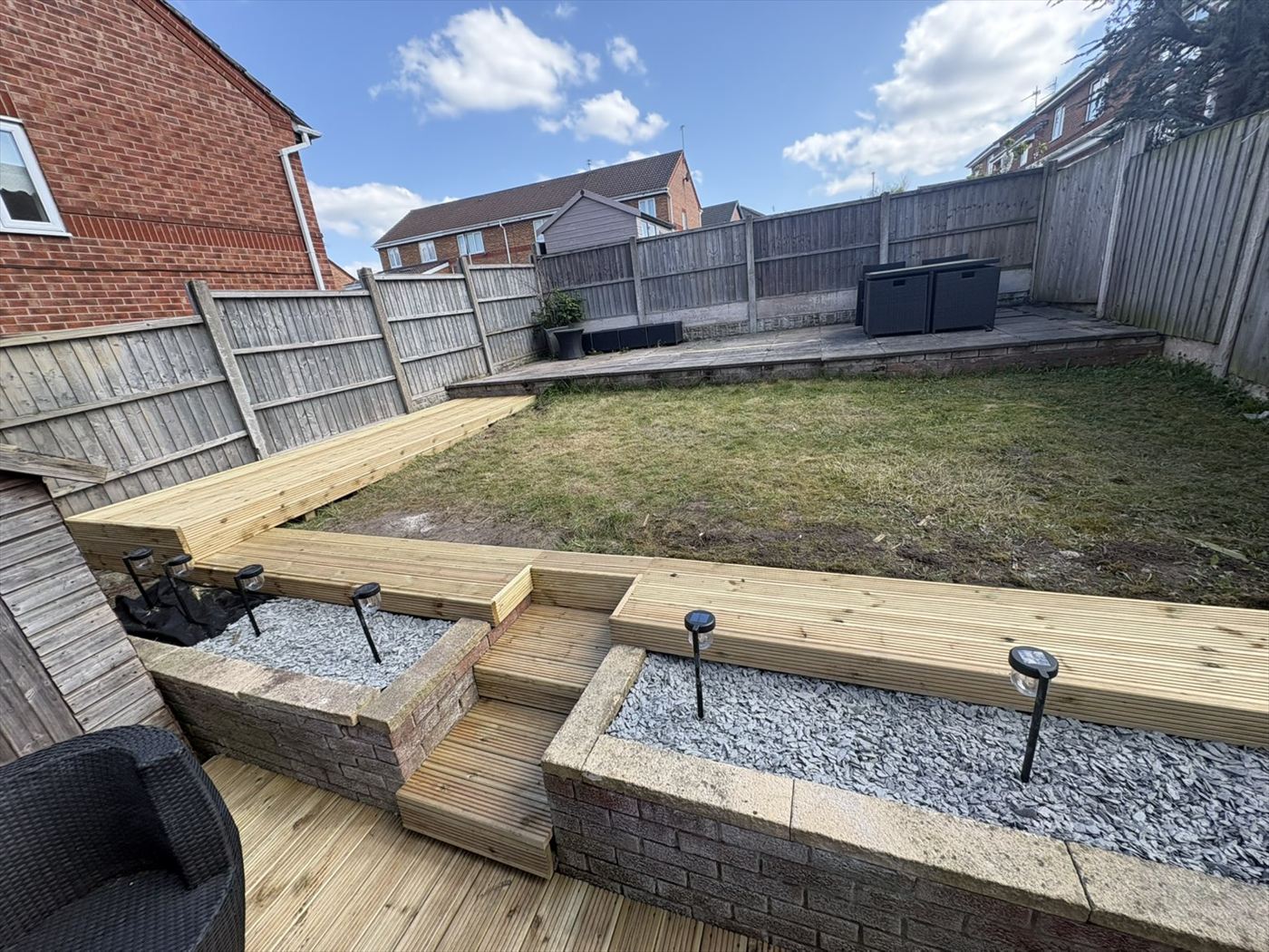 Tiered garden makeover with new decking, raised beds and slate by AJ Garden Services