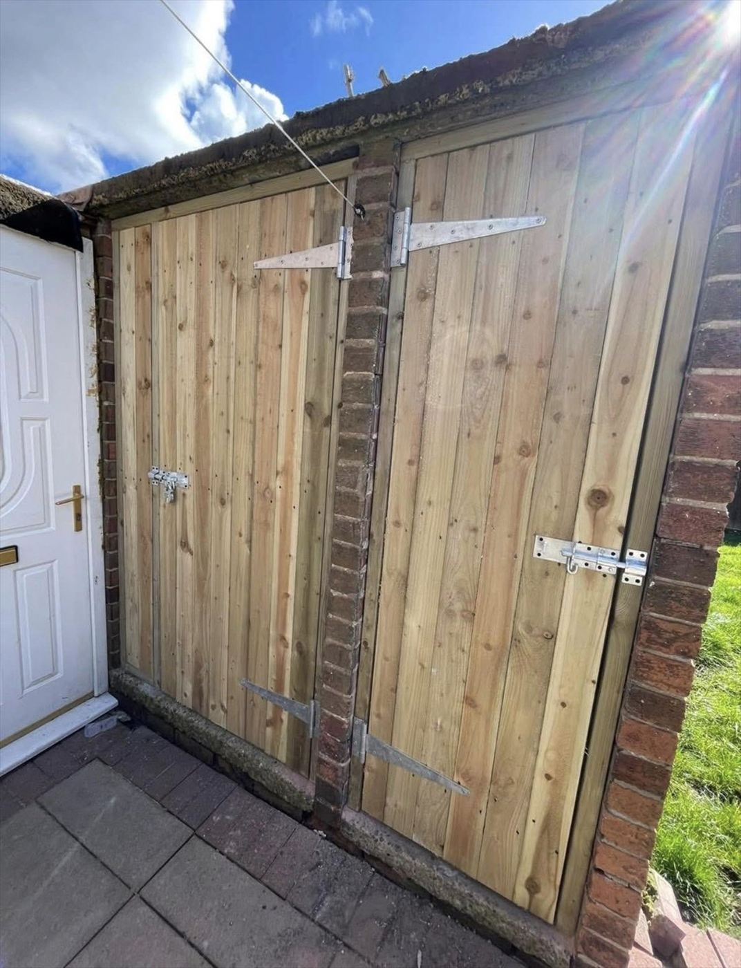 Bespoke timber garage doors made and fitted by AJ Garden Services
